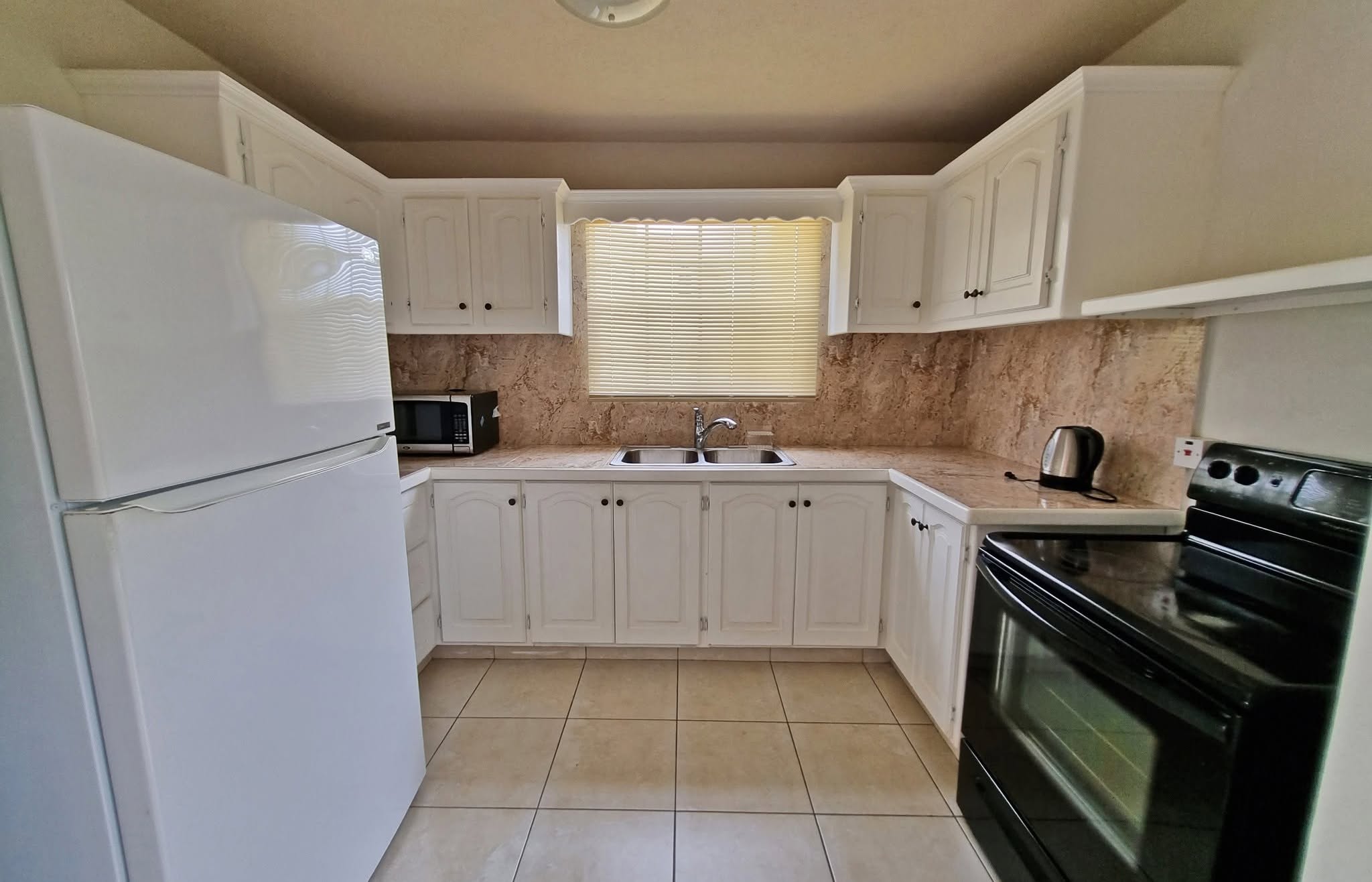 Furnished 2-Bed Townhouse for Rent in Husbands Heights, St. James – $1,500 USD/Month