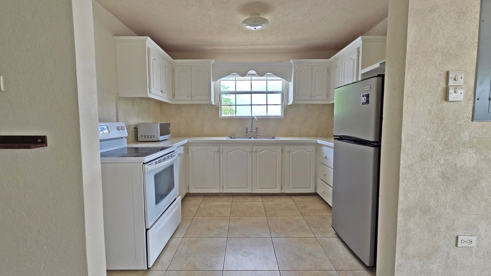 Fully Furnished 2-Bed Townhouse for Rent in Husbands Heights, St. James – $1,500 USD/Month